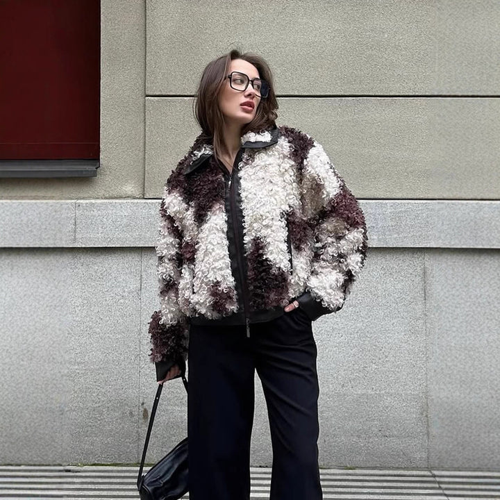 Women's short jacket made of curly bouclé faux fur with leather look detailing Mune Fashion