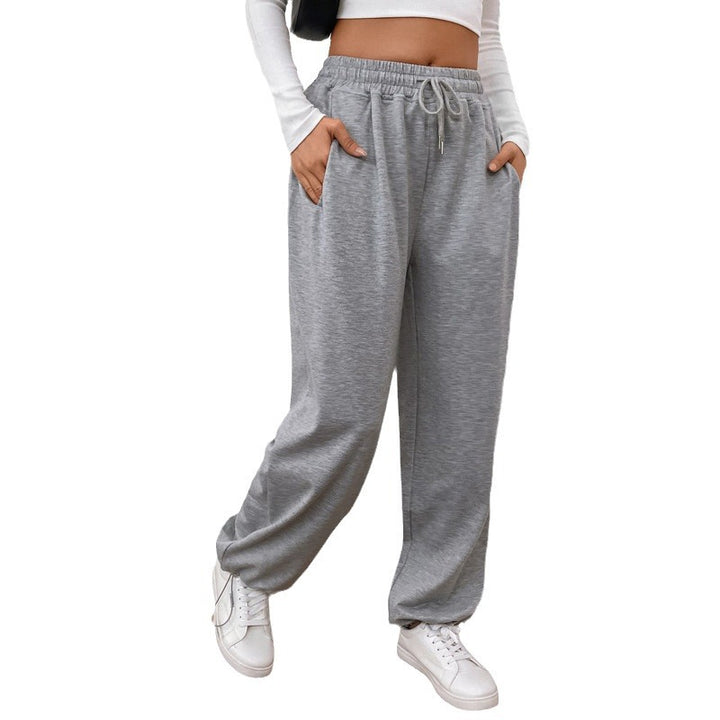 Women's wide sweatpants with elastic waistband, drawstring and adjustable hem.