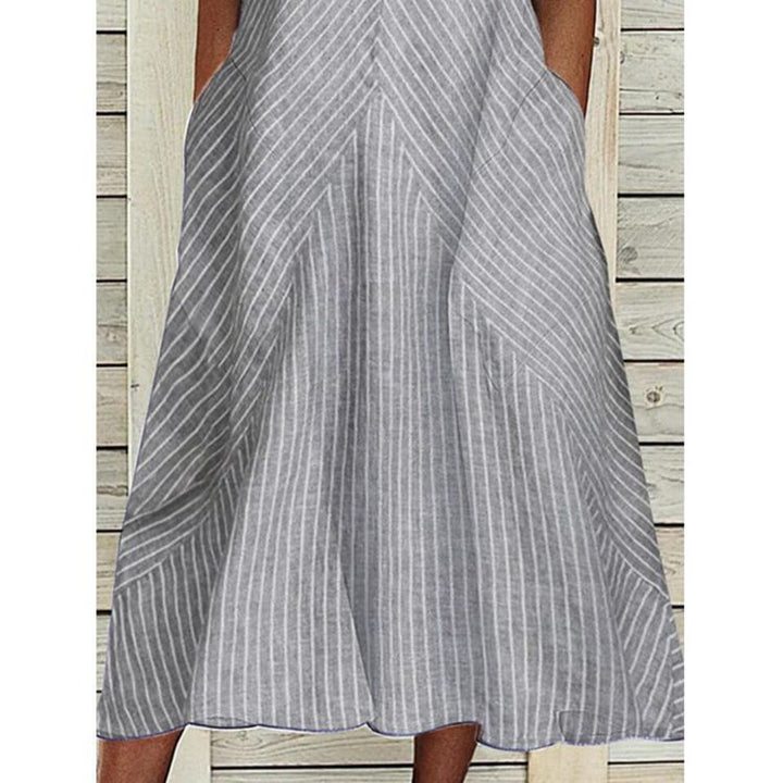 Women’s sleeveless A-line midi dress with ruffle V-neck, diagonal striped linen look and side pockets Mune Fashion