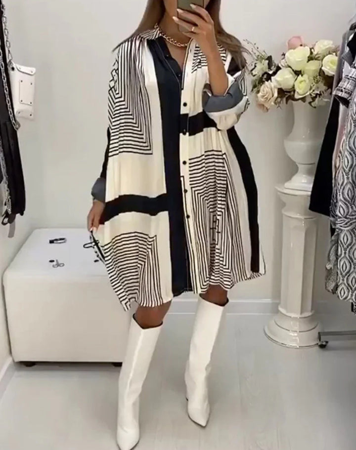 Women's knee-length A-line shirt dress with graphic line print, concealed button placket, and oversized cuffs Mune Fashion
