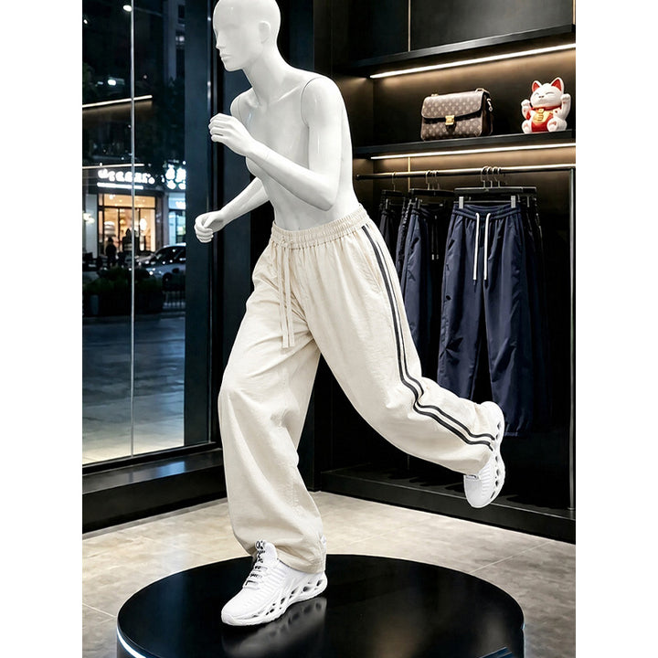 Women's sporty leisure pants with high waistband and side stripes Mune Fashion