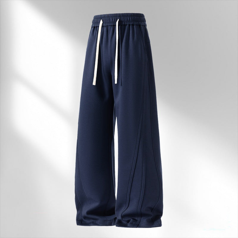 Women's wide lounge sweatpants with elastic drawstring waistband and decorative side seam details Mune Fashion