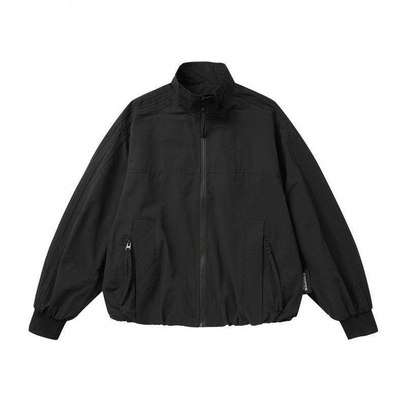 Unisex Lightweight Boxy Outdoor Jacket in Track Style with High Stand-Up Collar, Zipper Pockets and Elastic Hem Mune Fashion
