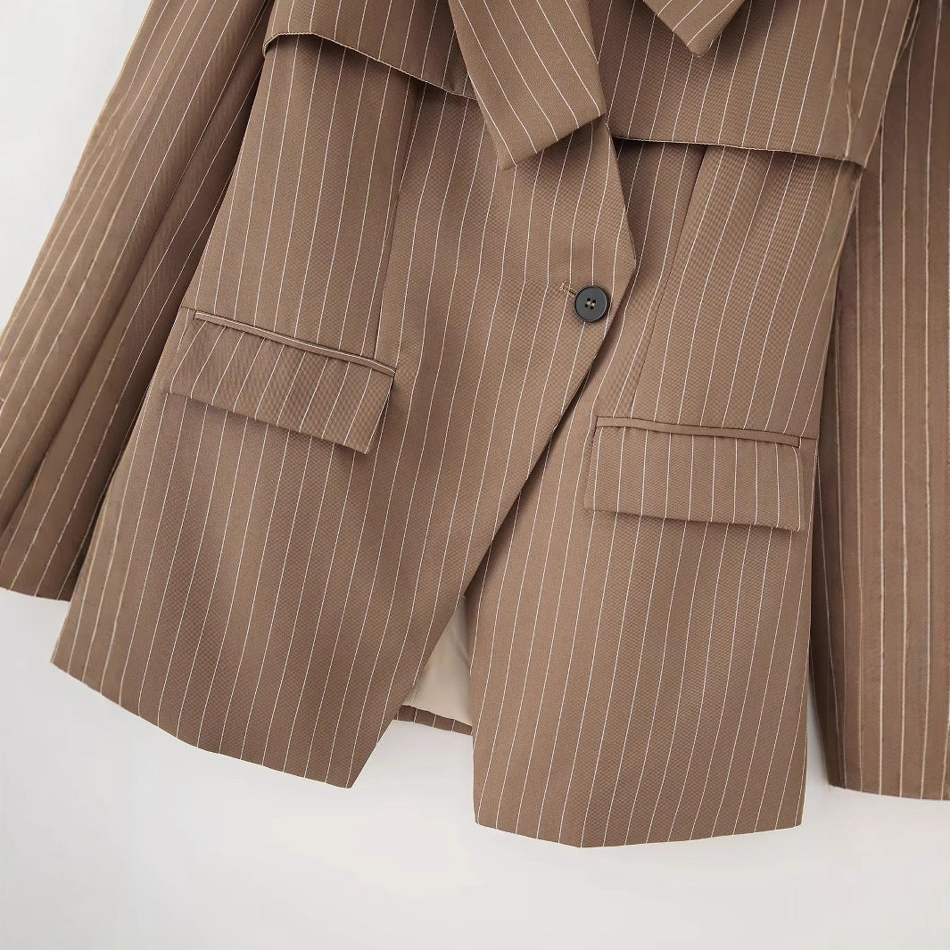 Women's striped oversized blazer with asymmetrical shawl collar overlay and flap pockets Mune Fashion