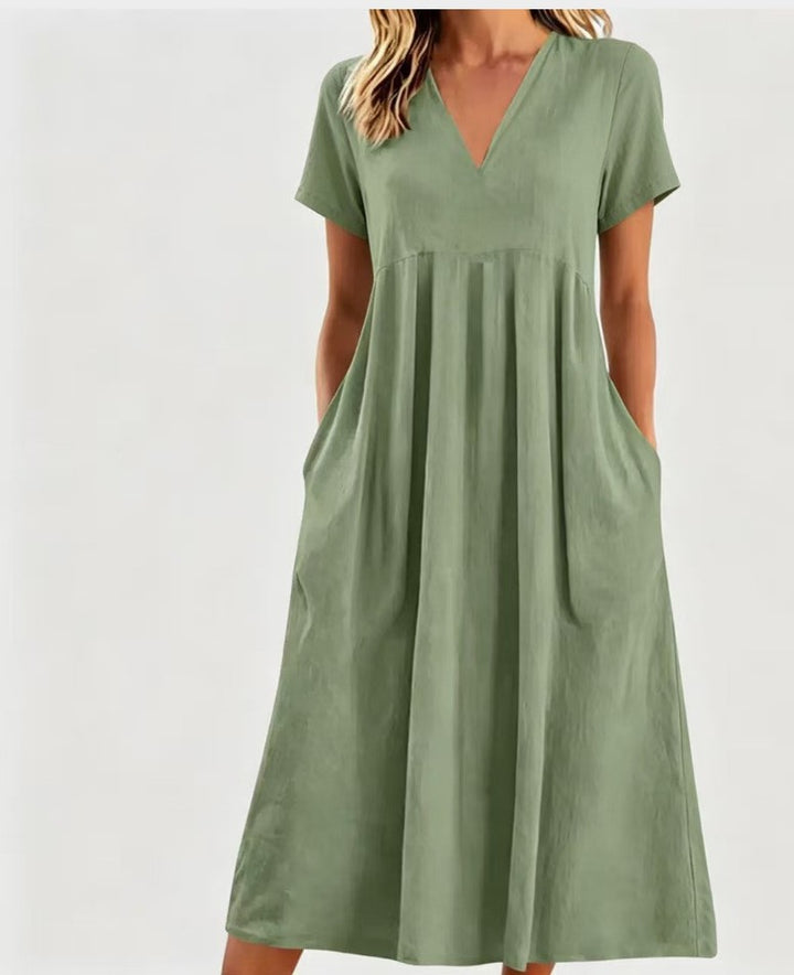 Women nan legeres V-neck midi dress with side pockets and gathered empire seam Mune Fashion