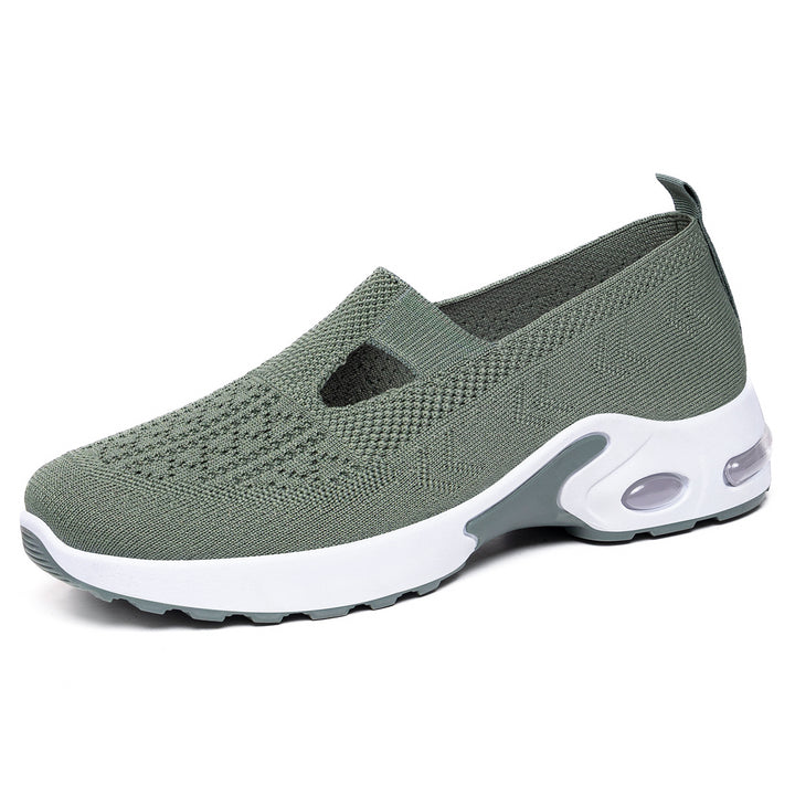 Women’s knitted slip-on sports slipper with elastic entry, cut-out detail, and visible air cushioning Mune Fashion