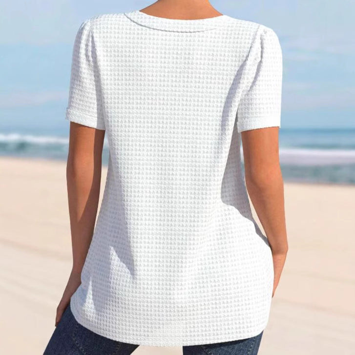 Women's finely structured V-neck top with decorative button placket and slightly flared silhouette Mune Fashion