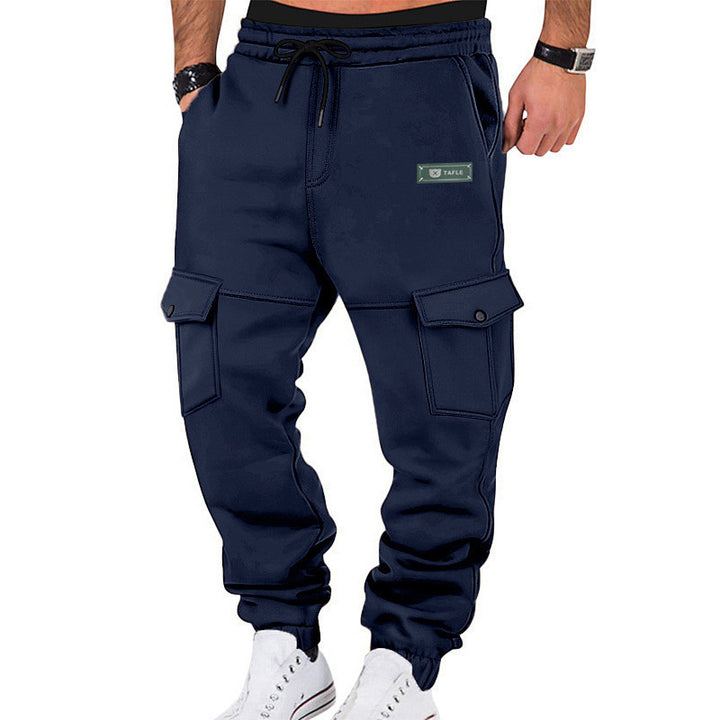 Men's cargo joggers with elastic cuffs, drawstring, and flap pockets.