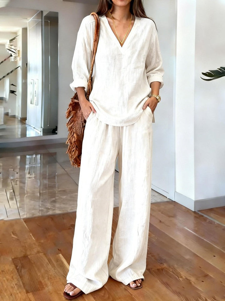 Women's lightweight linen look two-piece set with deep V-neck, loose 3/4 sleeves, and wide palazzo pants cut Mune Fashion