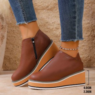 Women's Mune Fashion ankle boot with wedge heel, side zipper, and padded comfort insole