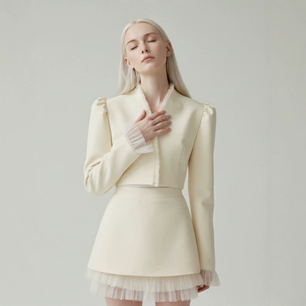 Ladies short blazer with tailored cropped silhouette, gathered shoulders and delicate tulle cuffs Mune Fashion
