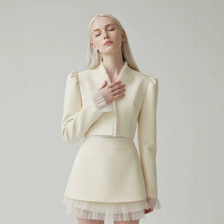 Ladies short blazer with tailored cropped silhouette, gathered shoulders and delicate tulle cuffs Mune Fashion