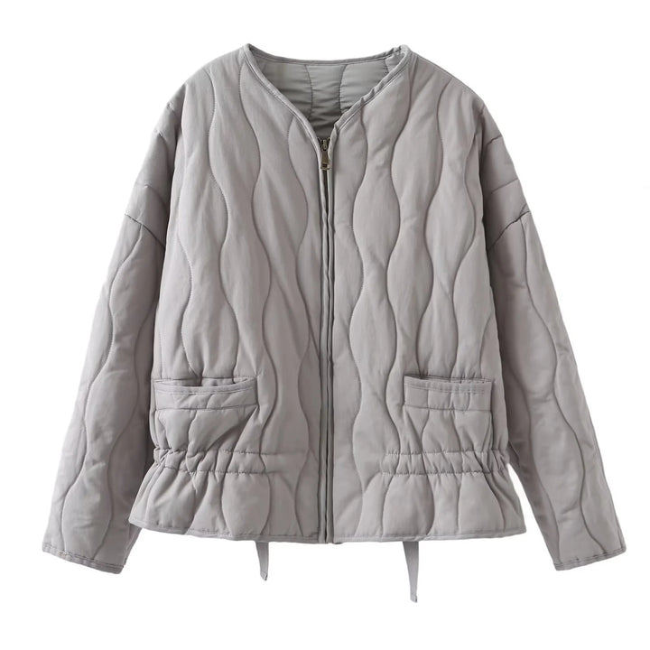 Ladies' nan quilted lightweight transitional jacket with wave quilting, patch flap pockets, and drawstring hem Mune Fashion