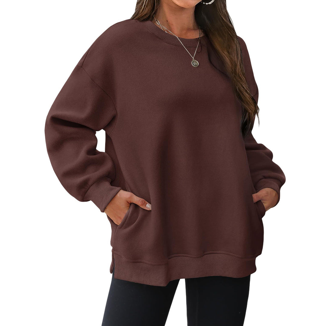 Women's extended oversized round neck sweater with side pockets, ribbed cuffs, and dropped shoulder Mune Fashion