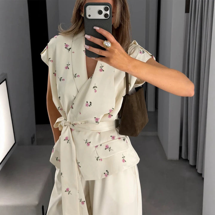 Women's sleeveless wrap blouse with fitted tie belt and patch pockets Mune Fashion