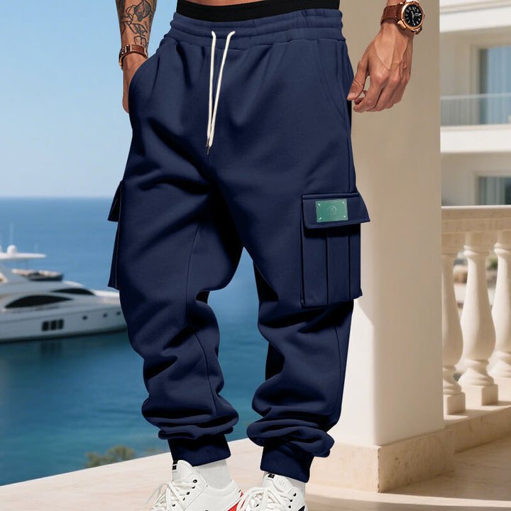 Men's Cargo Jogging Pants with generous flap pockets, elastic waistband, and ribbed hem Mune Fashion