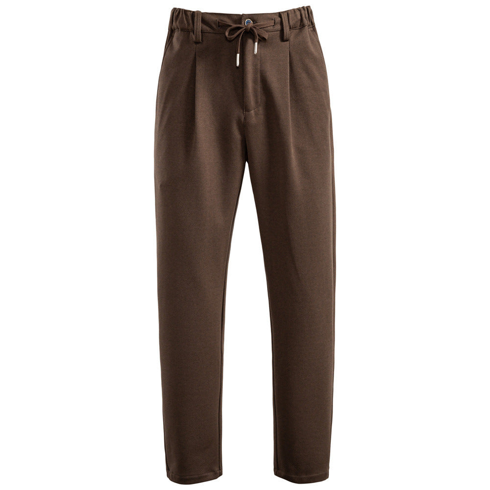 Men's pleated jogger-style trousers with drawstring, belt loops, and tapered cut Mune Fashion