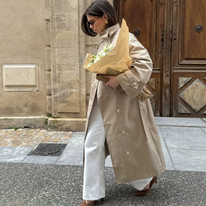 Women’s maxi trench coat with high stand-up collar, double-breasted button placket & waist belt Mune Fashion