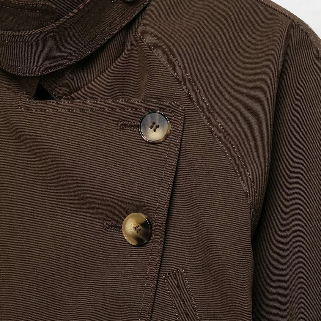 Women's short trench coat with high stand-up collar, tie belt, and asymmetrical button placket Mune Fashion