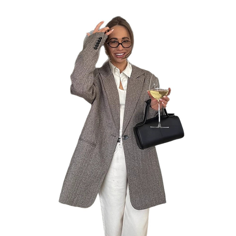 Women's long oversized wool blend coat with single-breasted button placket, notched lapels, and side pockets Mune Fashion