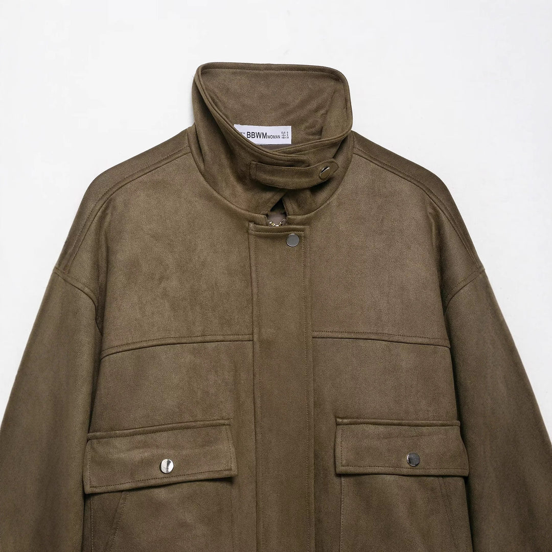 Women’s short jacket made of velour imitation with high funnel collar and flap pockets Mune Fashion