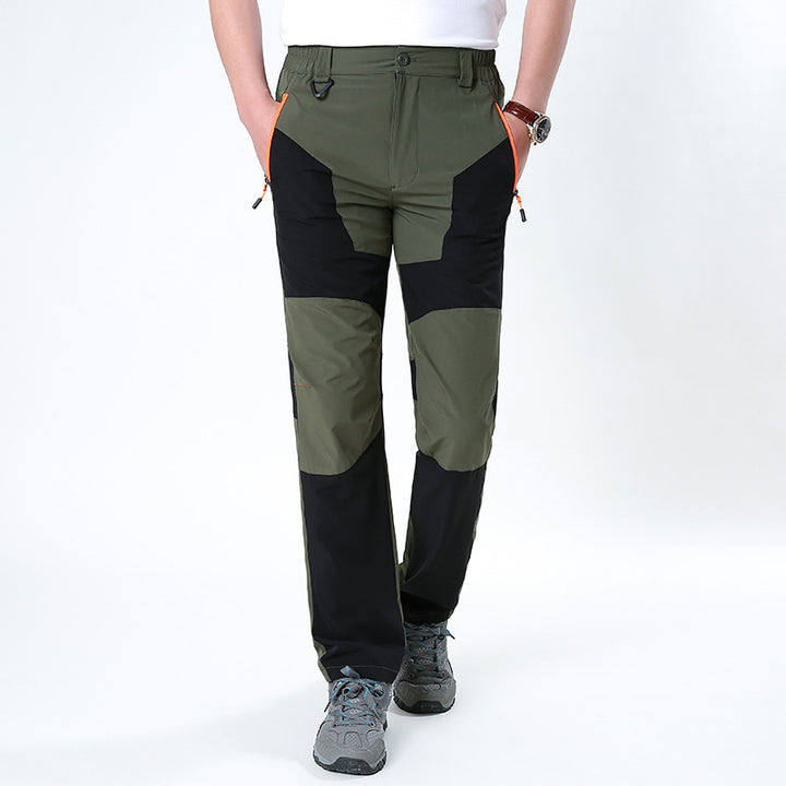 Men's functional trekking pants with reinforced knees, elastic waistband, and zipper pockets.