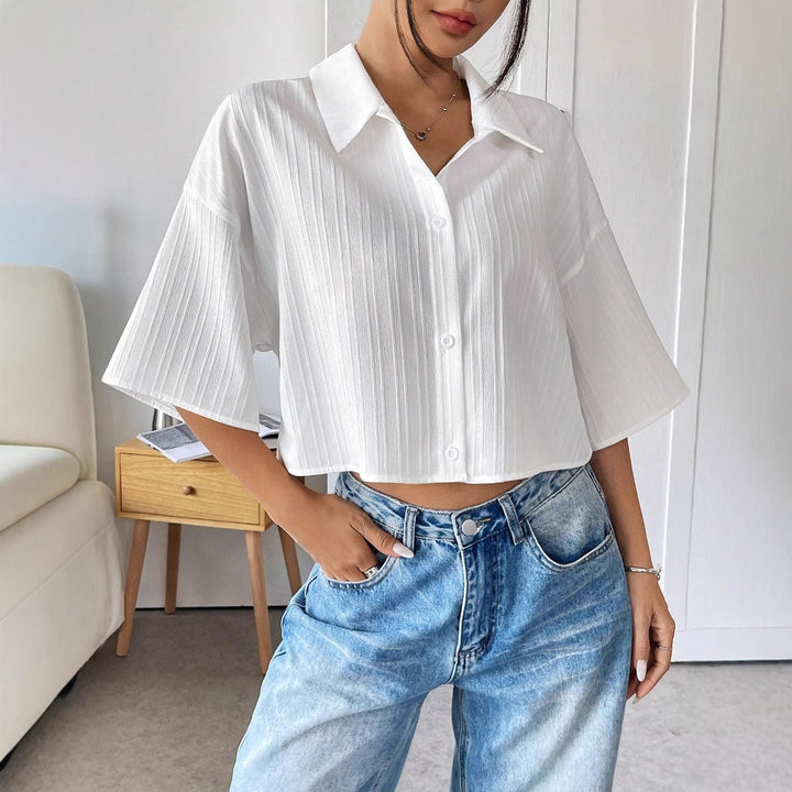 Ladies oversized short blouse with shirt collar and fine pleat structure Mune Fashion