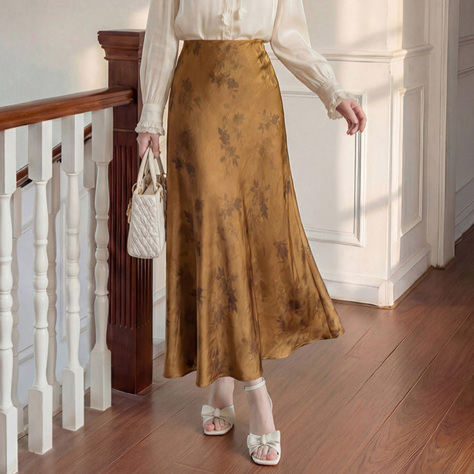 Women's high-waisted A-line midi skirt in jacquard-like satin with floral relief print.