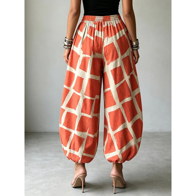 Women's wide harem pants in balloon style with elastic waistband and graphic check pattern Mune Fashion