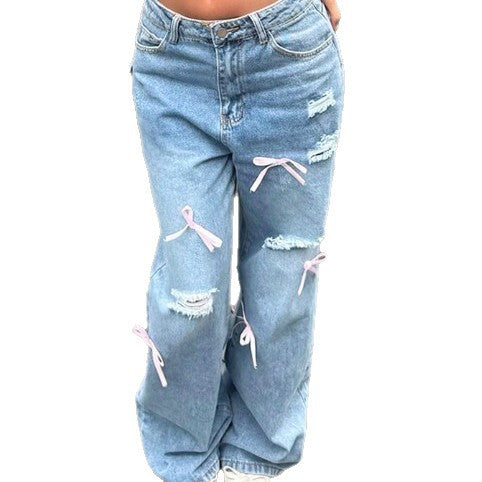 Women High-Waist Baggy Jeans with Vintage Wash, Rips and Pink Bow Applications Mune Fashion