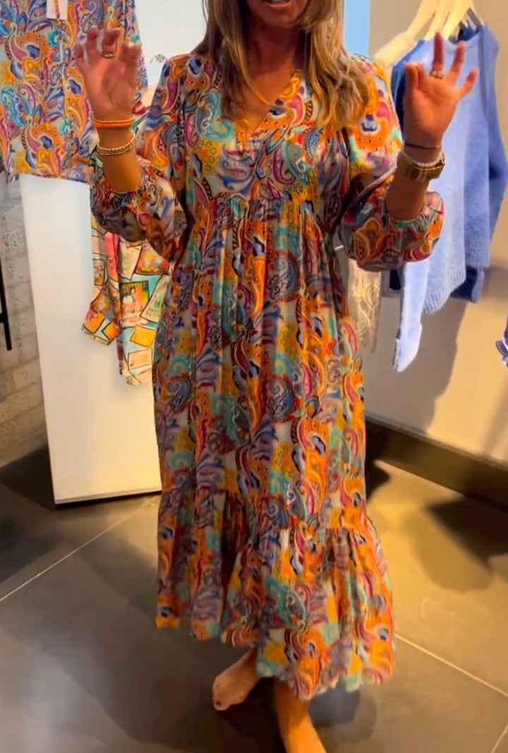 Women's tiered maxi dress in boho style with paisley print, V-neck, gathered empire waist and elastic cuffs Mune Fashion
