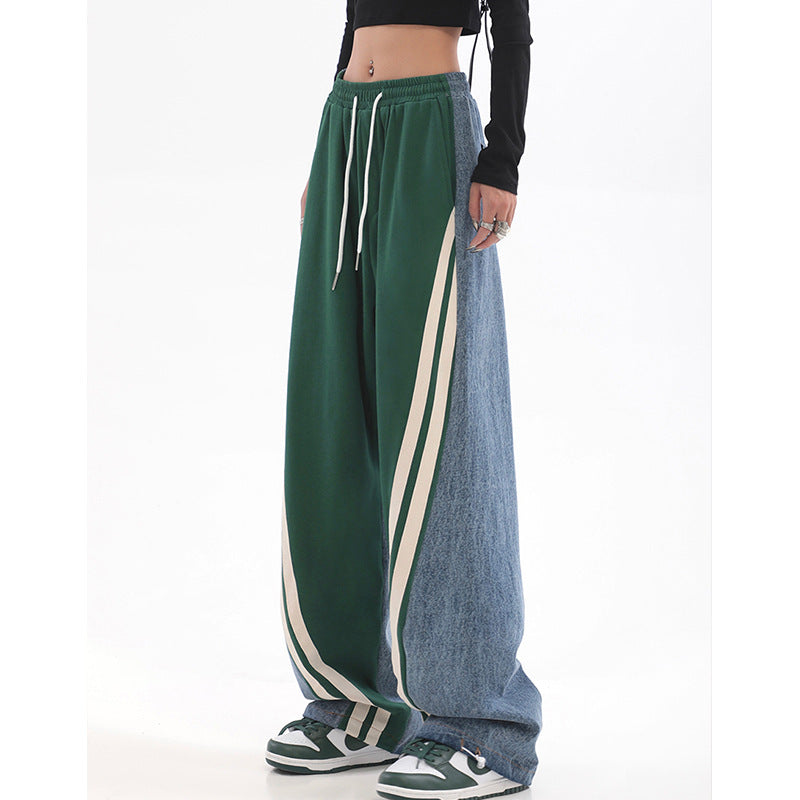 Ladies loose-fitting jogging pants with denim inserts, elastic waistband, and side contrast stripes Mune Fashion