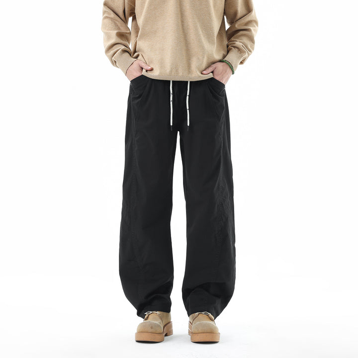 Men's Light Relaxed-Fit Trousers with Drawstring, Slanted Side Pockets and Panel Seams Mune Fashion