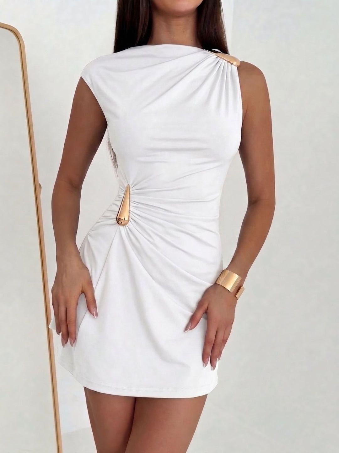 Women's asymmetrical fitted mini dress with one-sided shoulder detail and metallic decorative fittings Mune Fashion