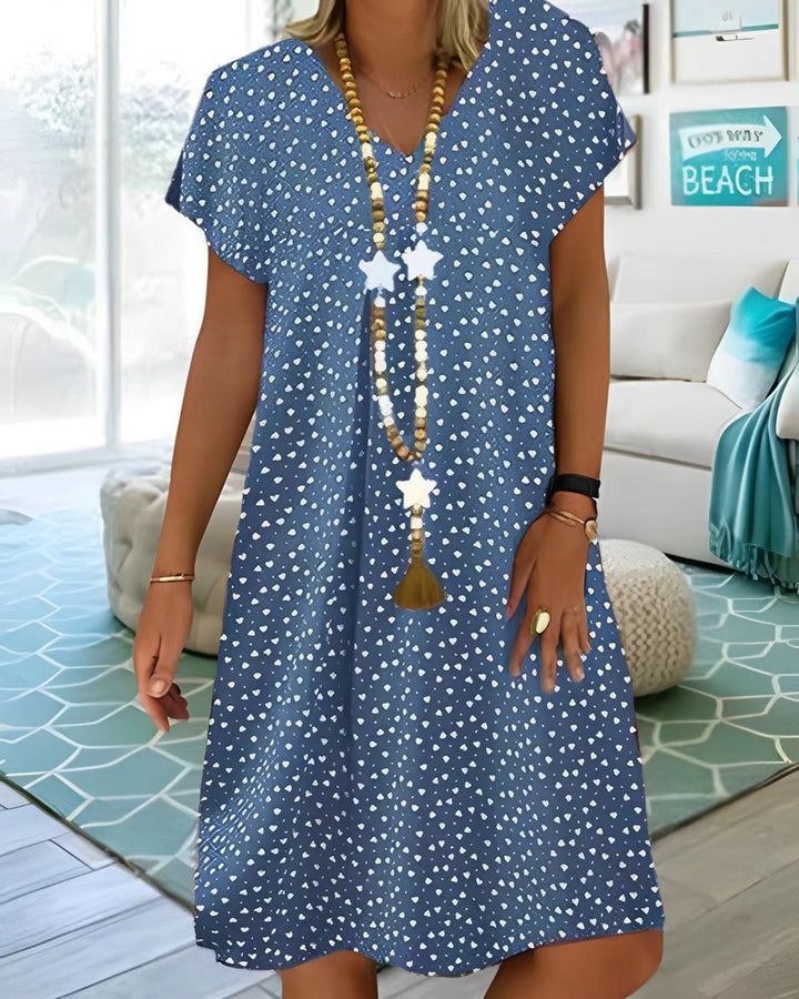 Ladies nan locker falling V-neck short dress with A-line cut, cap sleeves and all-over heart print Mune Fashion