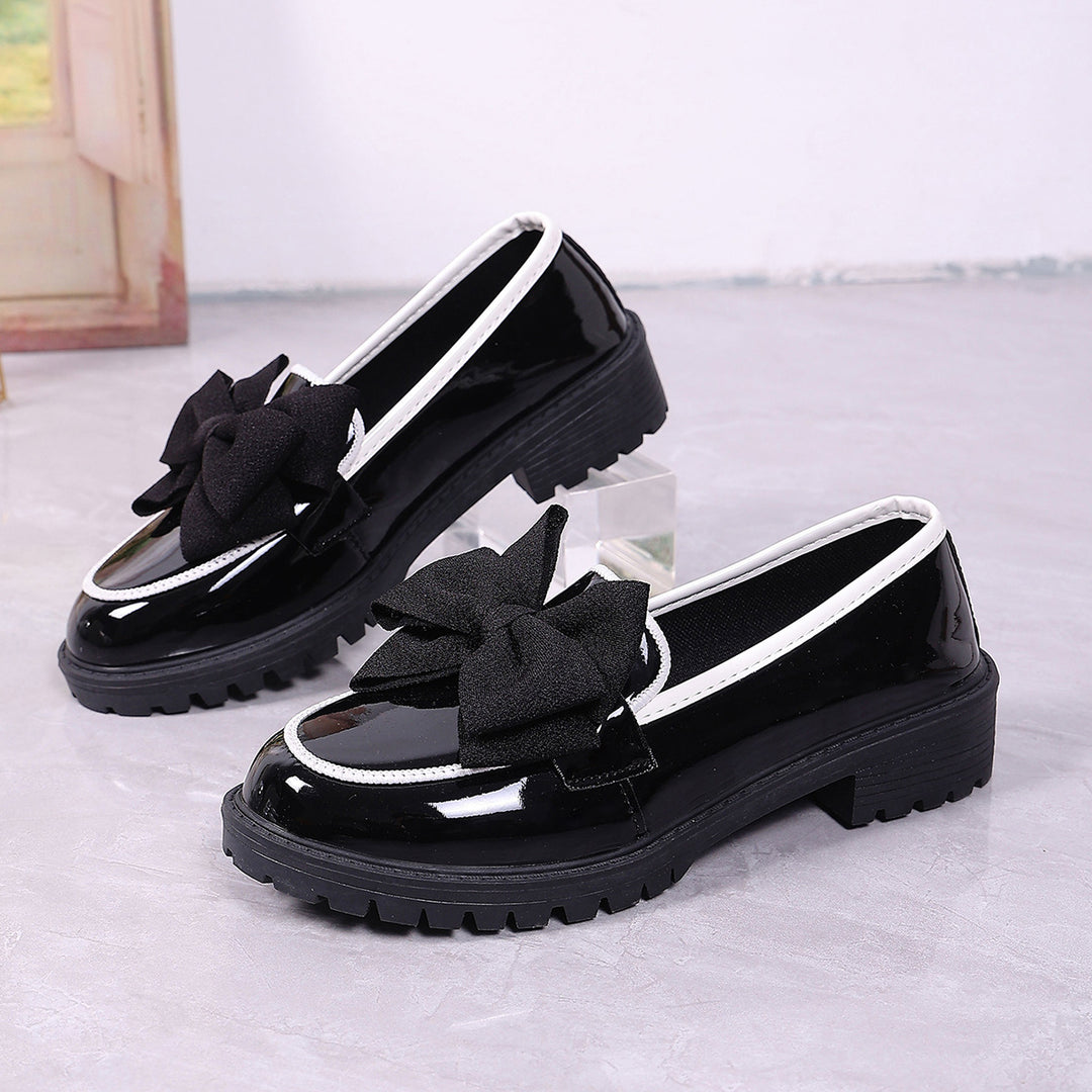 Women's patent leather platform loafers with patterned rubber sole and decorative bow Mune Fashion