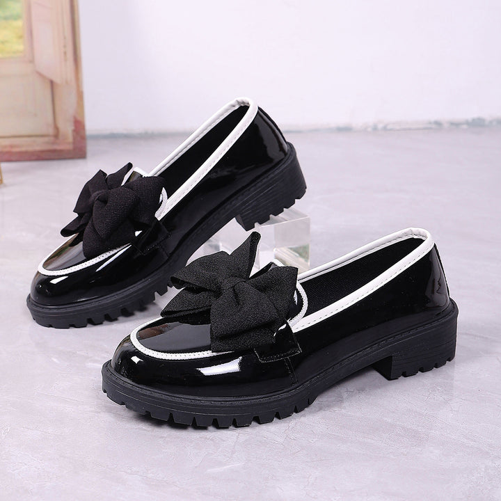 Women's patent leather platform loafers with patterned rubber sole and decorative bow Mune Fashion