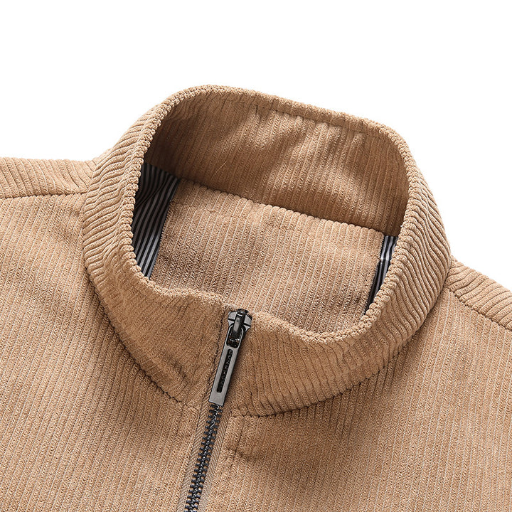 Men's fine corduroy jacket with stand-up collar, striped lining, and concealed snap pockets.
