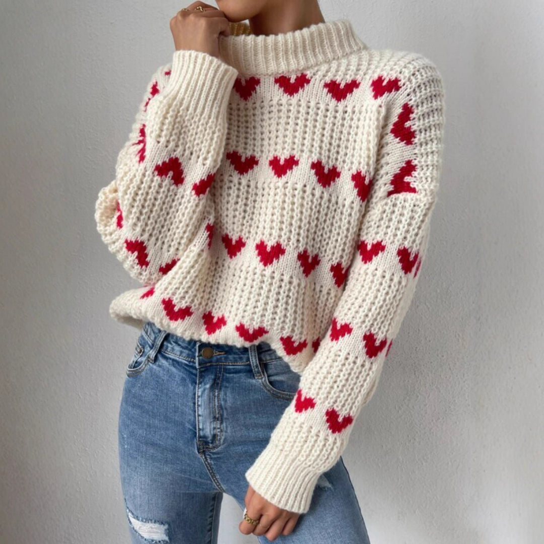 Women's chunky knit sweater with knitted heart patterns, high stand-up collar, and relaxed oversized silhouette Mune Fashion