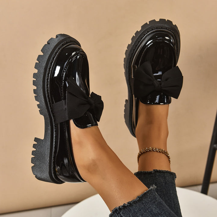 Ladies patent loafers with distinctive profile sole and decorative bow Mune Fashion