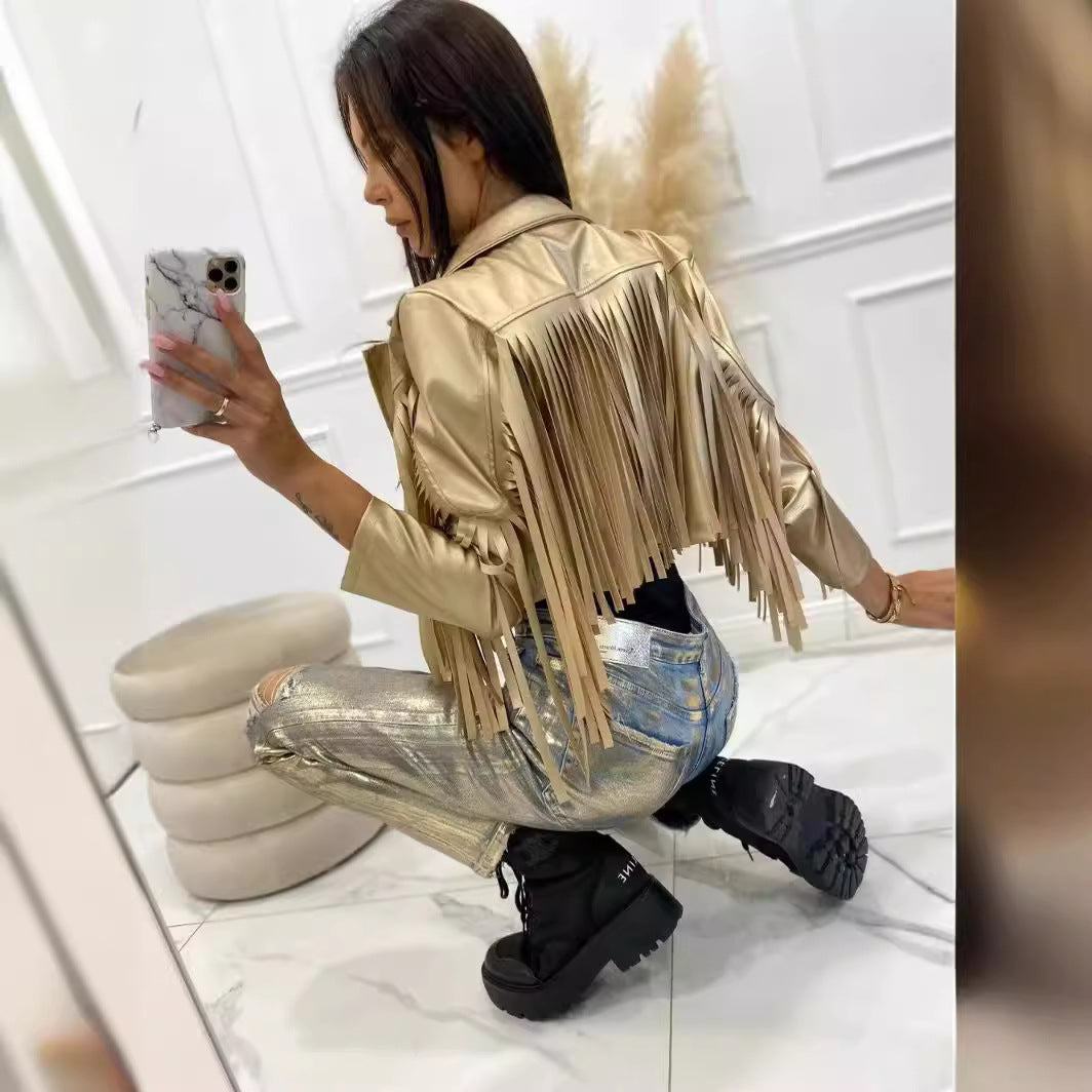 Women’s short jacket in biker style with metallic look and long leather fringes Mune Fashion
