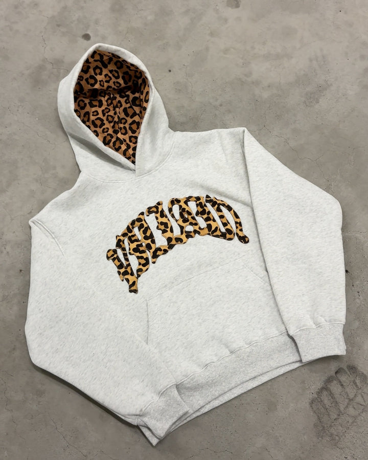 Women's high-cut jogging pants with flared leg, elastic ruffled waistband and leopard stitch detail Mune Fashion