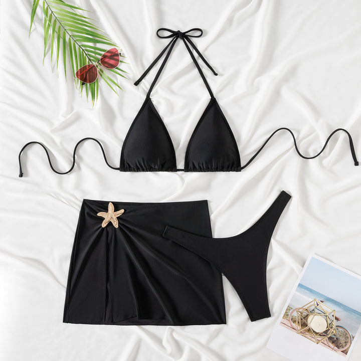Women's bikini with elegant wrap skirt and decorative shell applique Mune Fashion