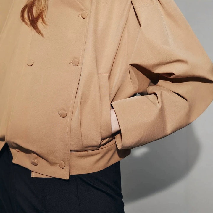 Women's short jacket in a boxy cropped cut with double button placket and structured shoulder pleats Mune Fashion