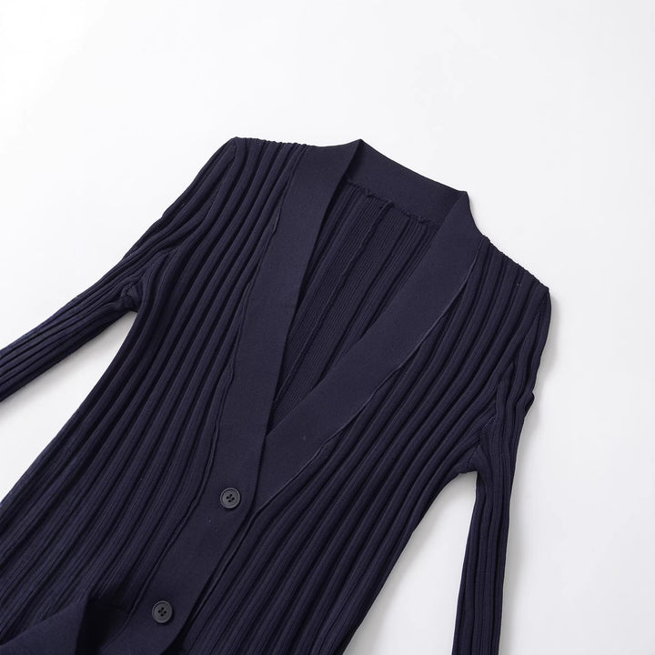 Women's ribbed knit cardigan with shawl collar, fitted flounce hem and button placket Mune Fashion