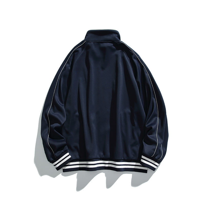 Unisex Sportive Track Jacket in oversized cut with stand-up collar, contrast piping and ribbed cuffs Mune Fashion