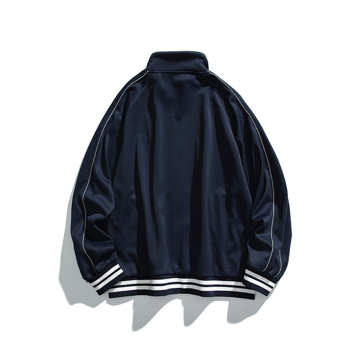 Unisex Sportive Track Jacket in oversized cut with stand-up collar, contrast piping and ribbed cuffs Mune Fashion