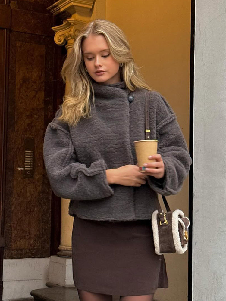 Women short cut teddy faux fur blouse jacket with high stand-up collar and boxy silhouette Mune Fashion