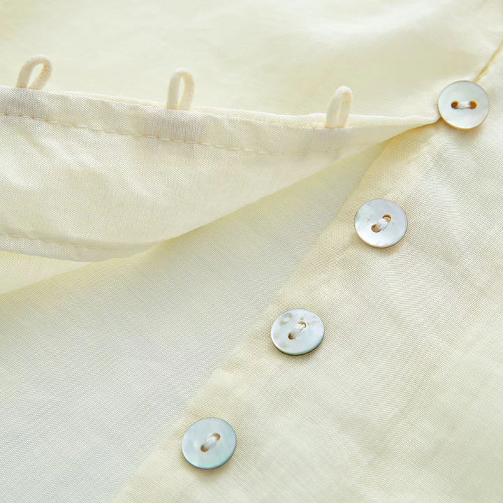 Women's delicate long sleeve blouse with tie ribbon at the neck and fine button placket Mune Fashion