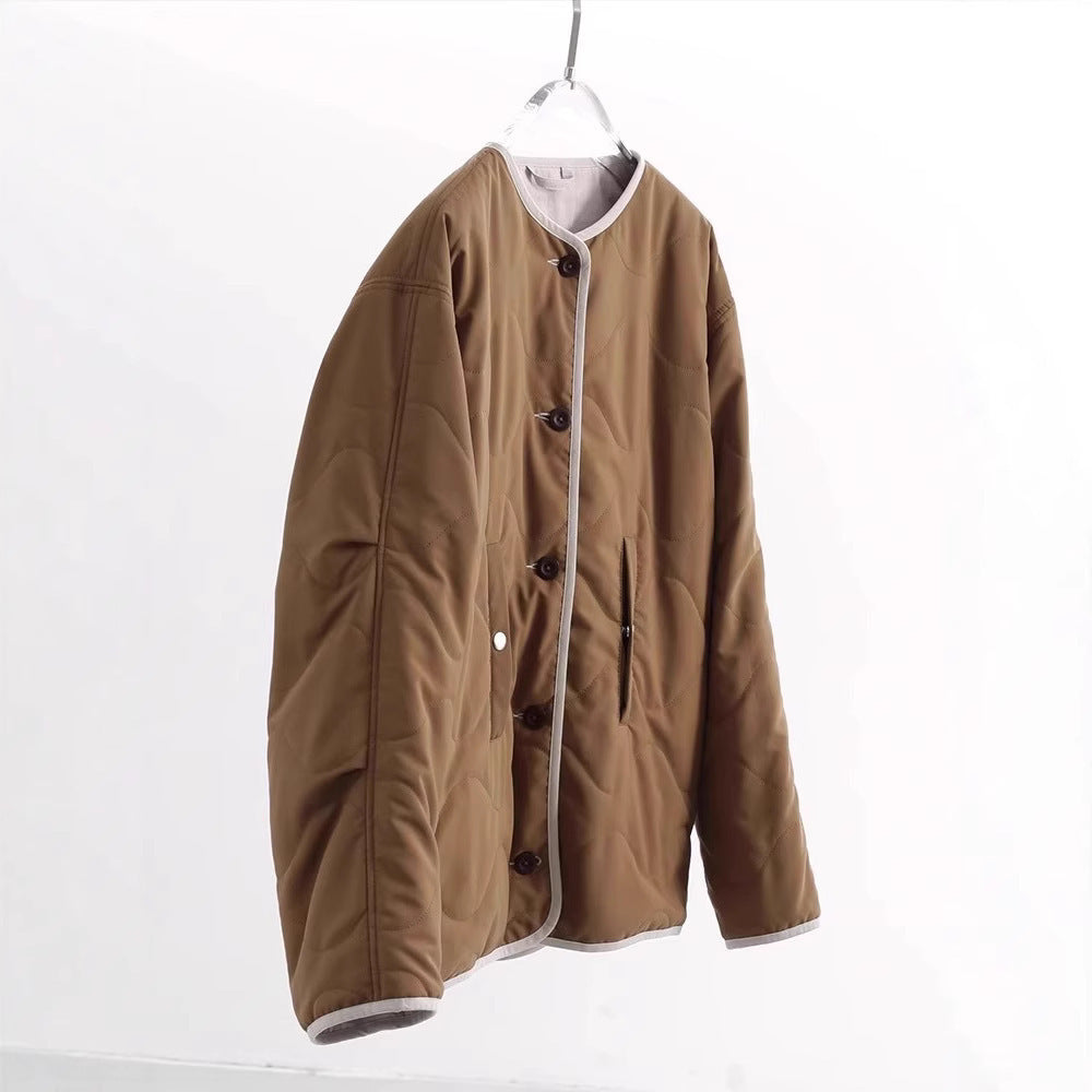 Women's quilted jacket without collar with oversized silhouette and contrast piping Mune Fashion
